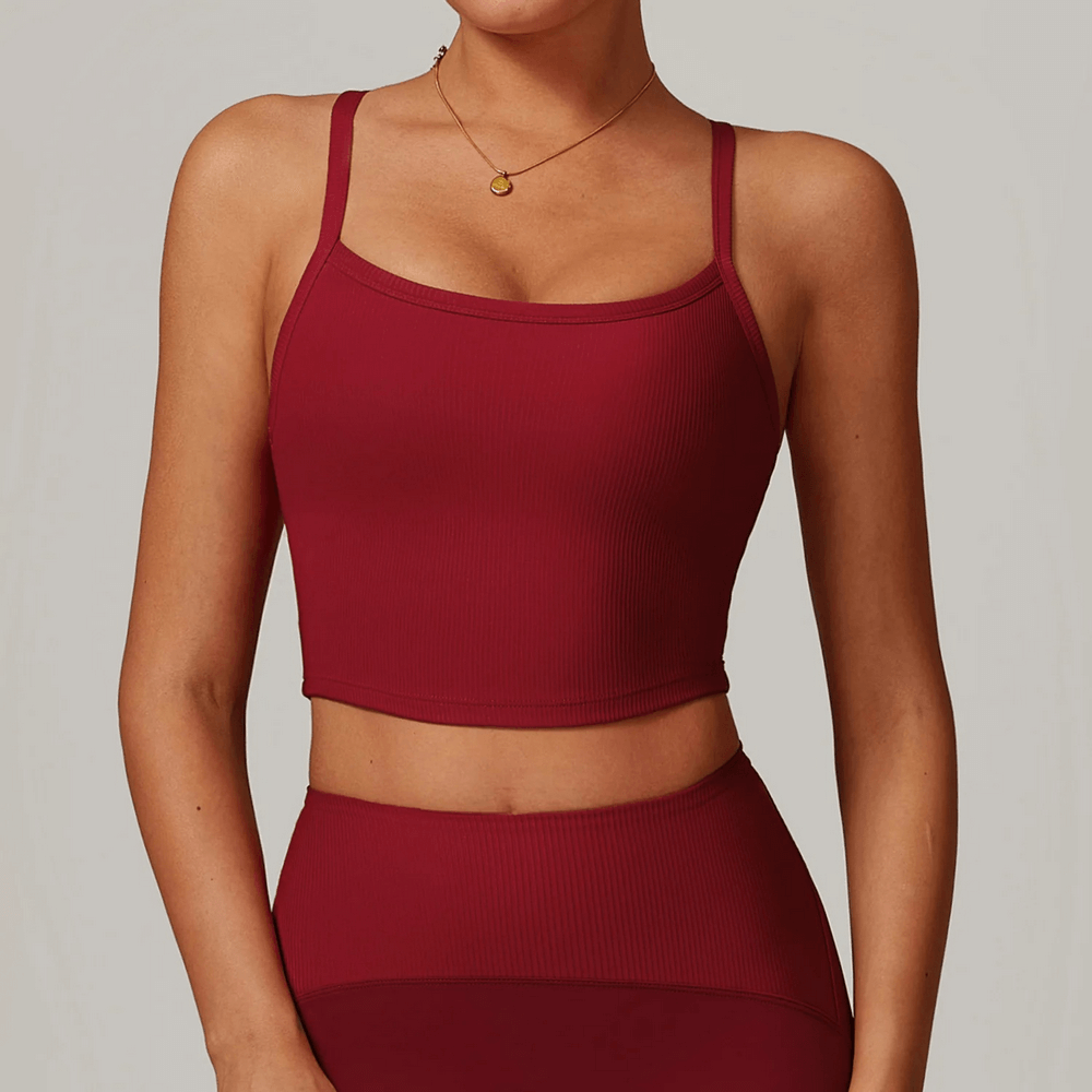 Model wearing red Ladies Elastic Ribbed Racerback Sports Tank Top SF2444, perfect for yoga and workouts. Stylish and breathable design.